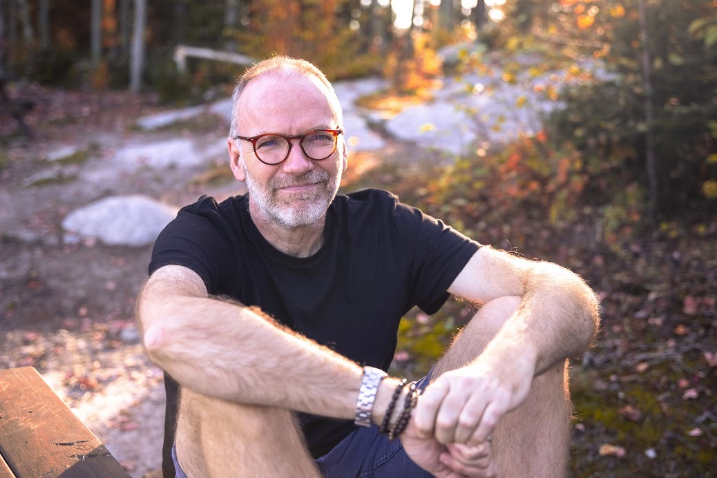 UCD alumnus Andrew Burton Anderson sitting outside.